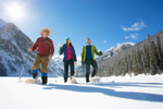 A group of snowshoers in Lake Louise take in the wintry view which surrounds them