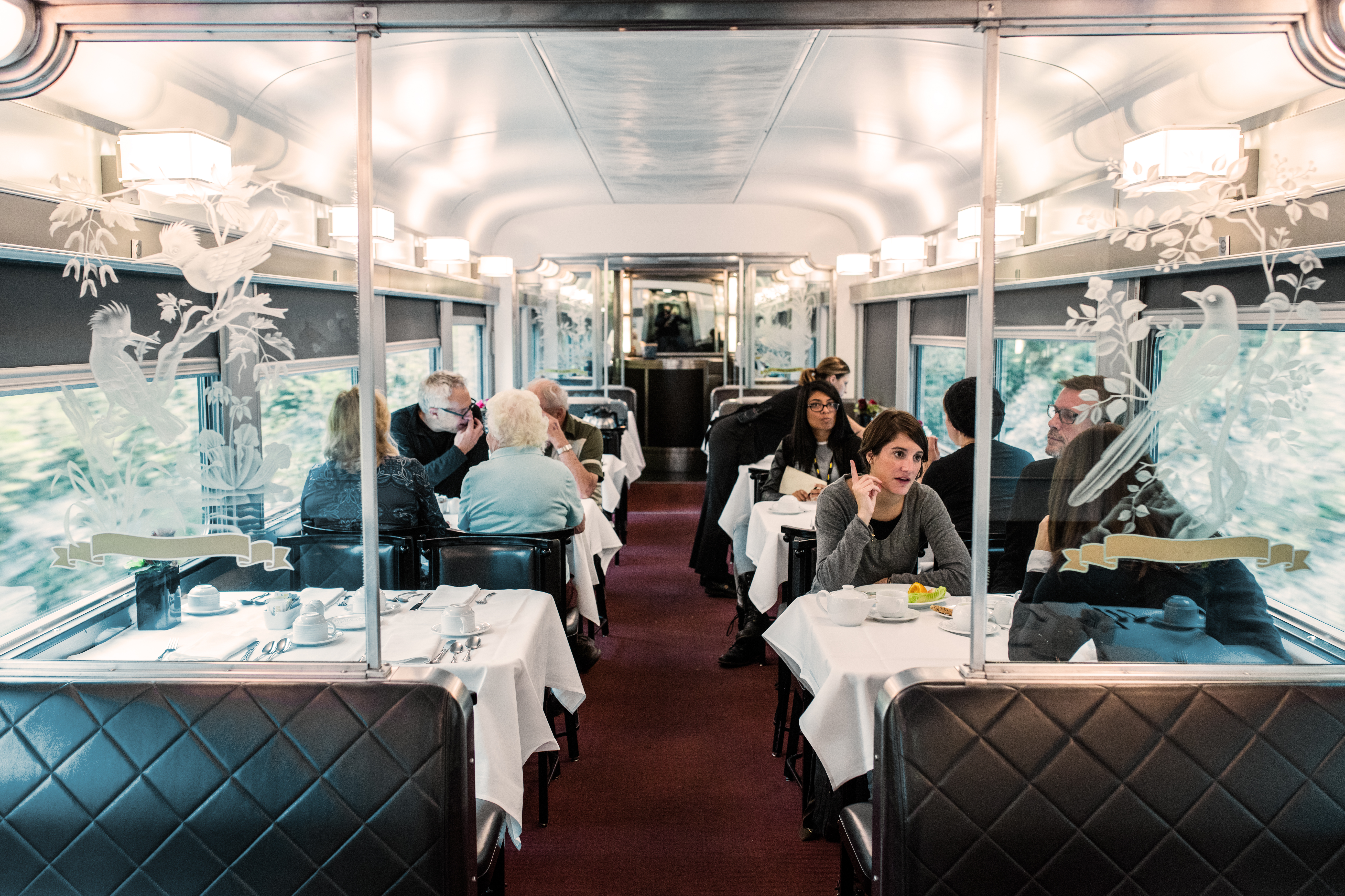 Enjoy scenic views in the dining car of The Canadian