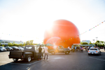 A giant orange orb next to a parking lot in Montreal