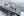 People walking across a trestle bridge in the snow