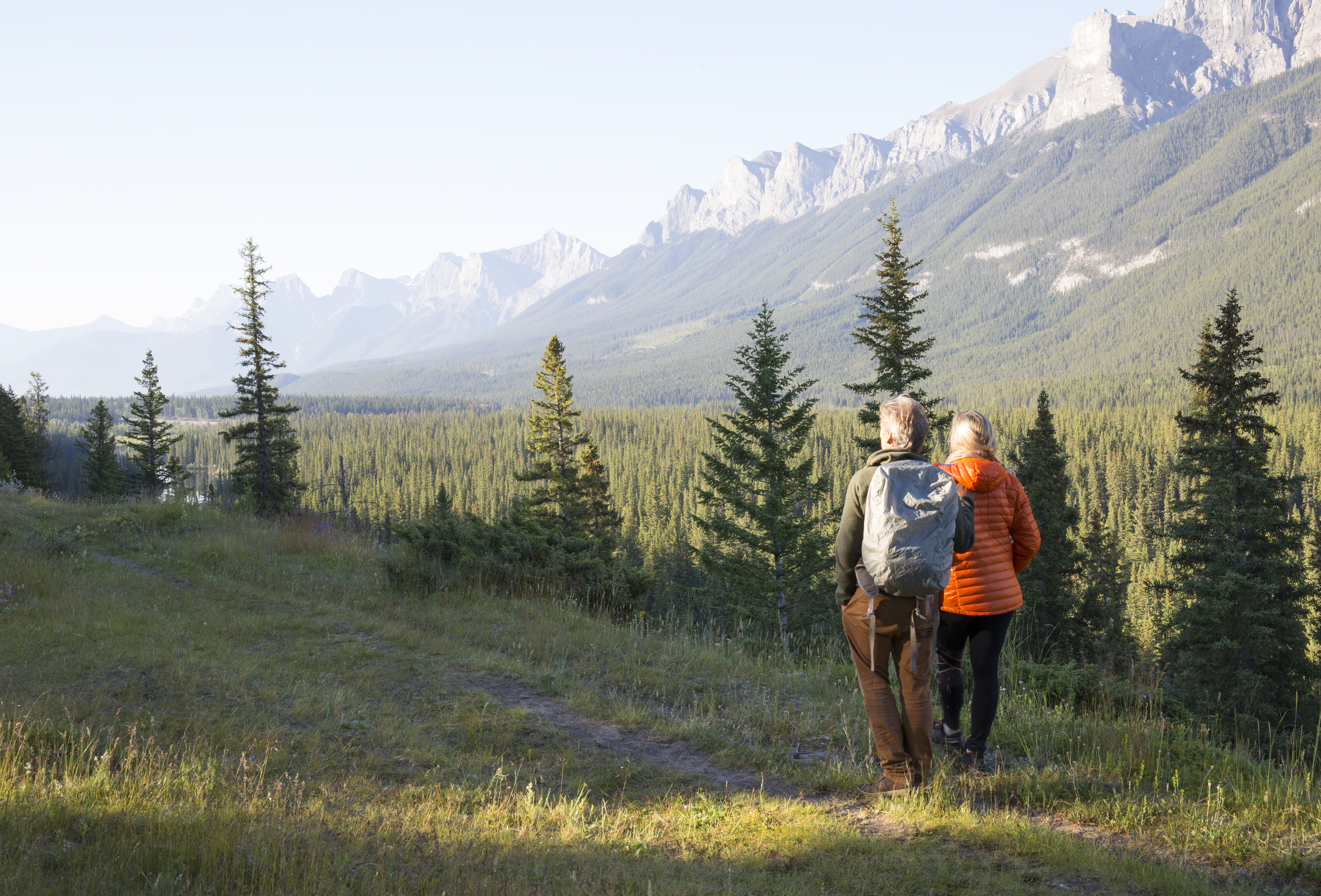 Two hikers stop to admire the alpine views 