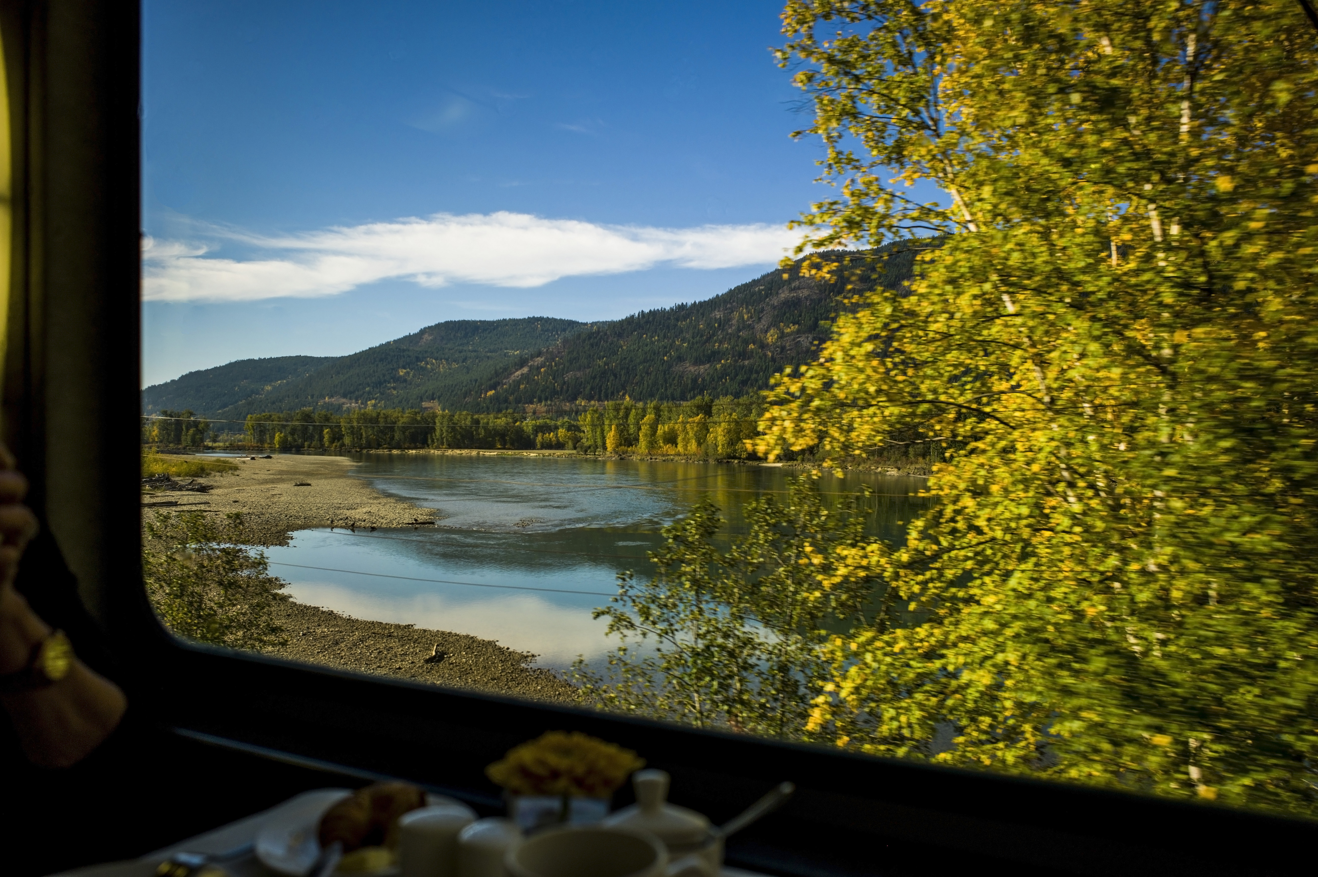View of lake and mountains from a train window