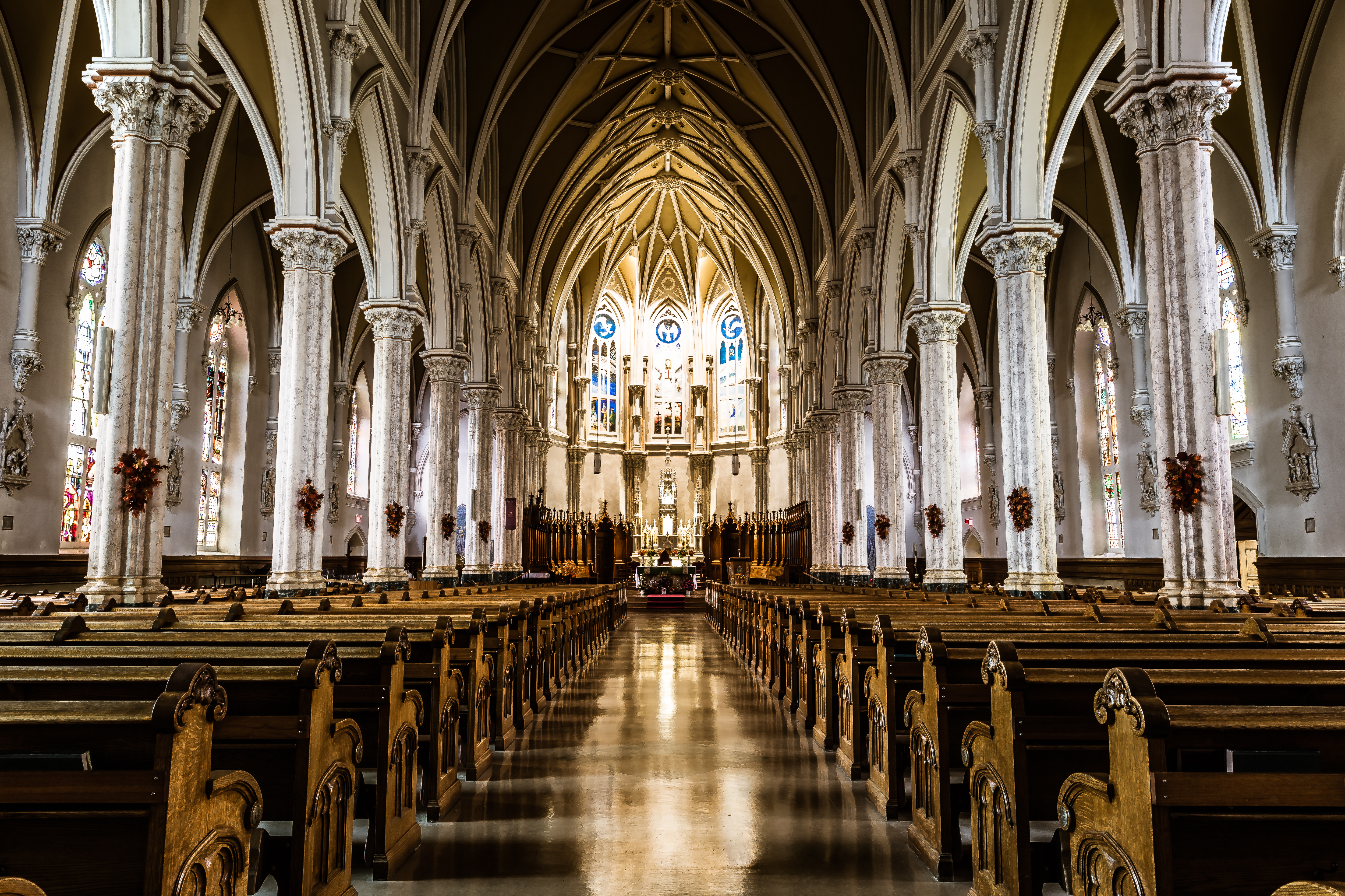 Interior of church from with intricate ceiling and windows