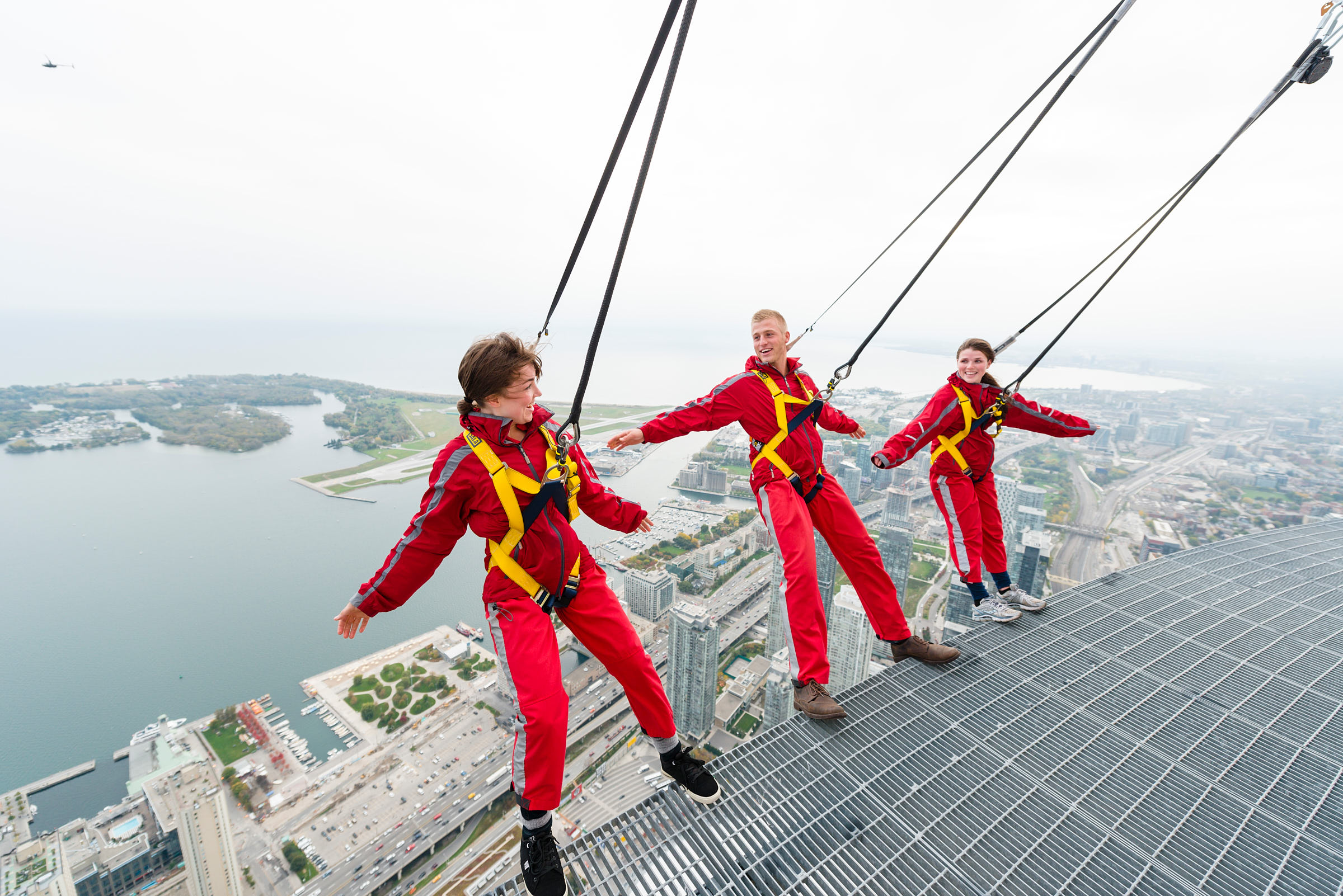 Three friends experience the Edgewalk at the CN Tower
