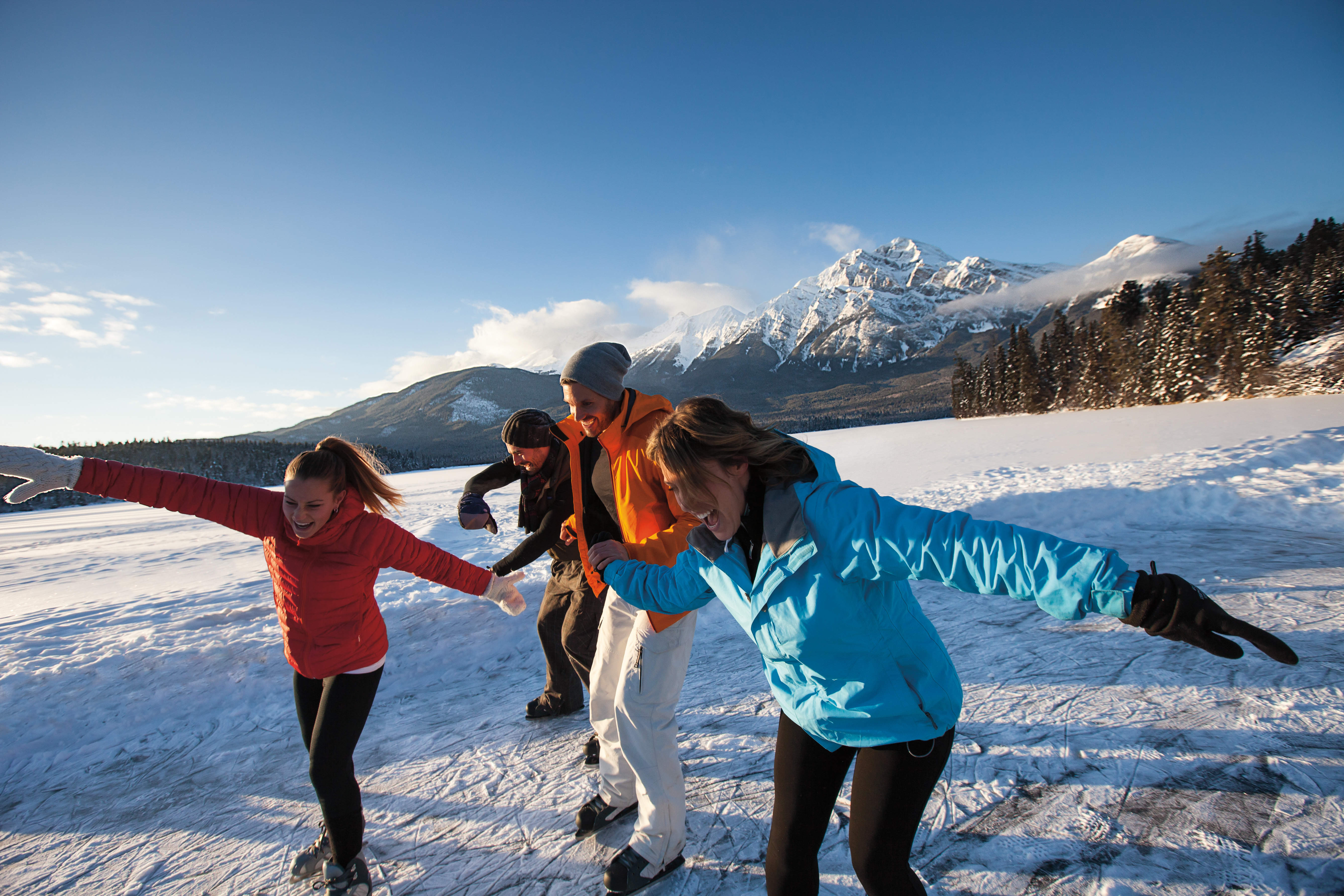 A family skates on Pyramid Lake in Jasper