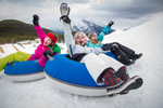 Winter activities in the Rockies include snow tubing at Mount Norquay