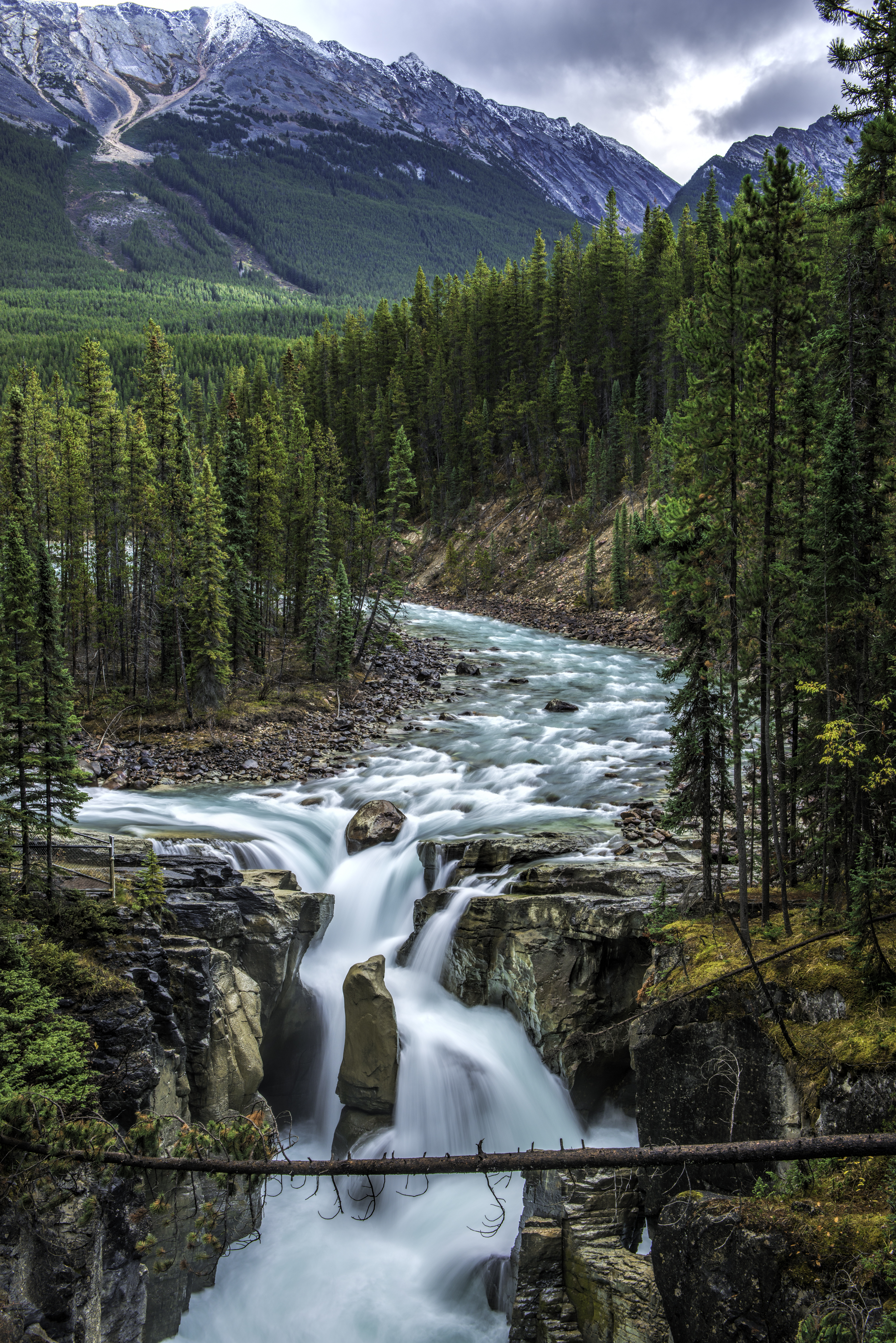 Glacial river flowing into a waterfall in Jasper