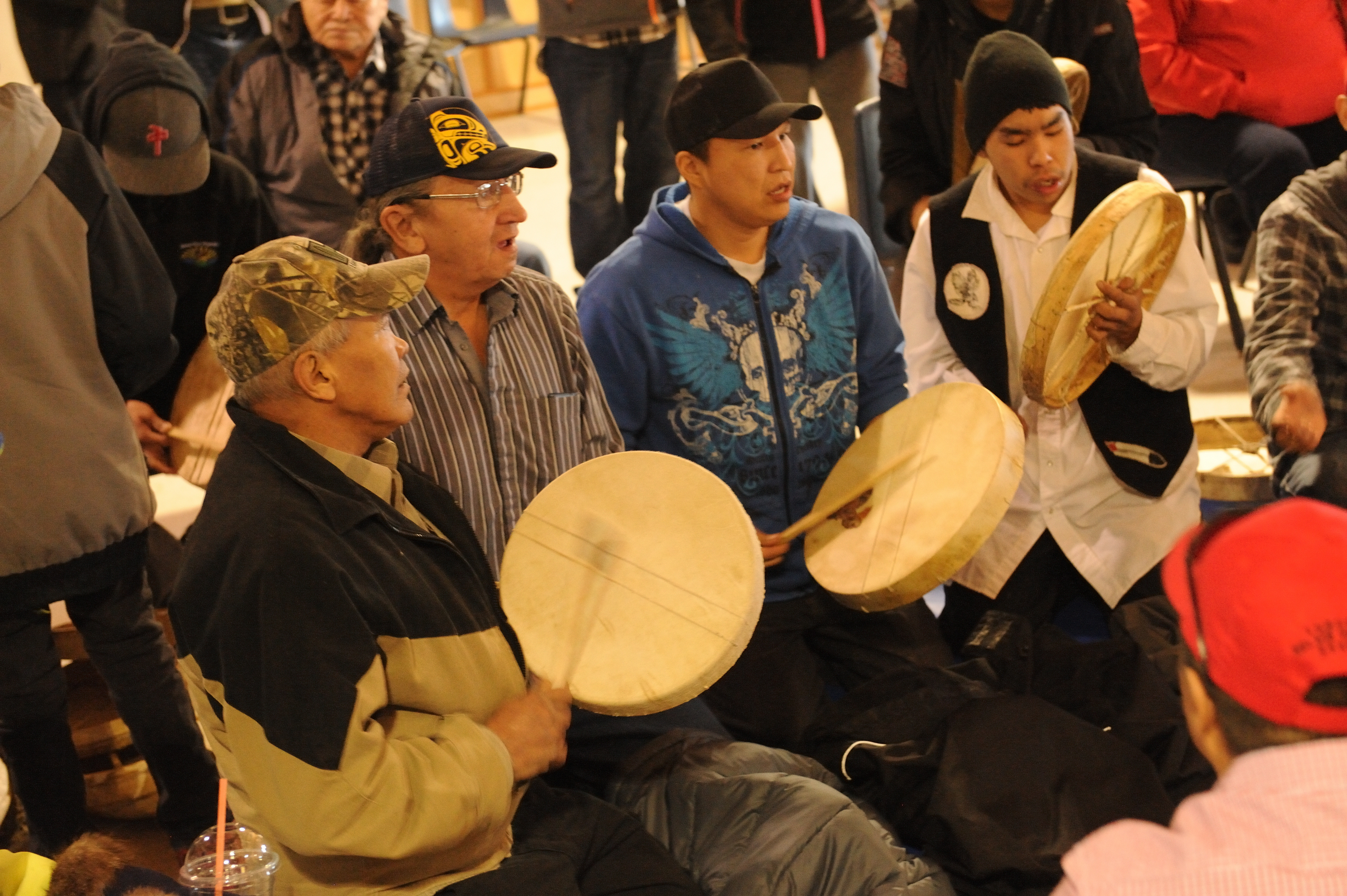 Indigenous peoples gather and play drums in Northwest Territories, Canada 