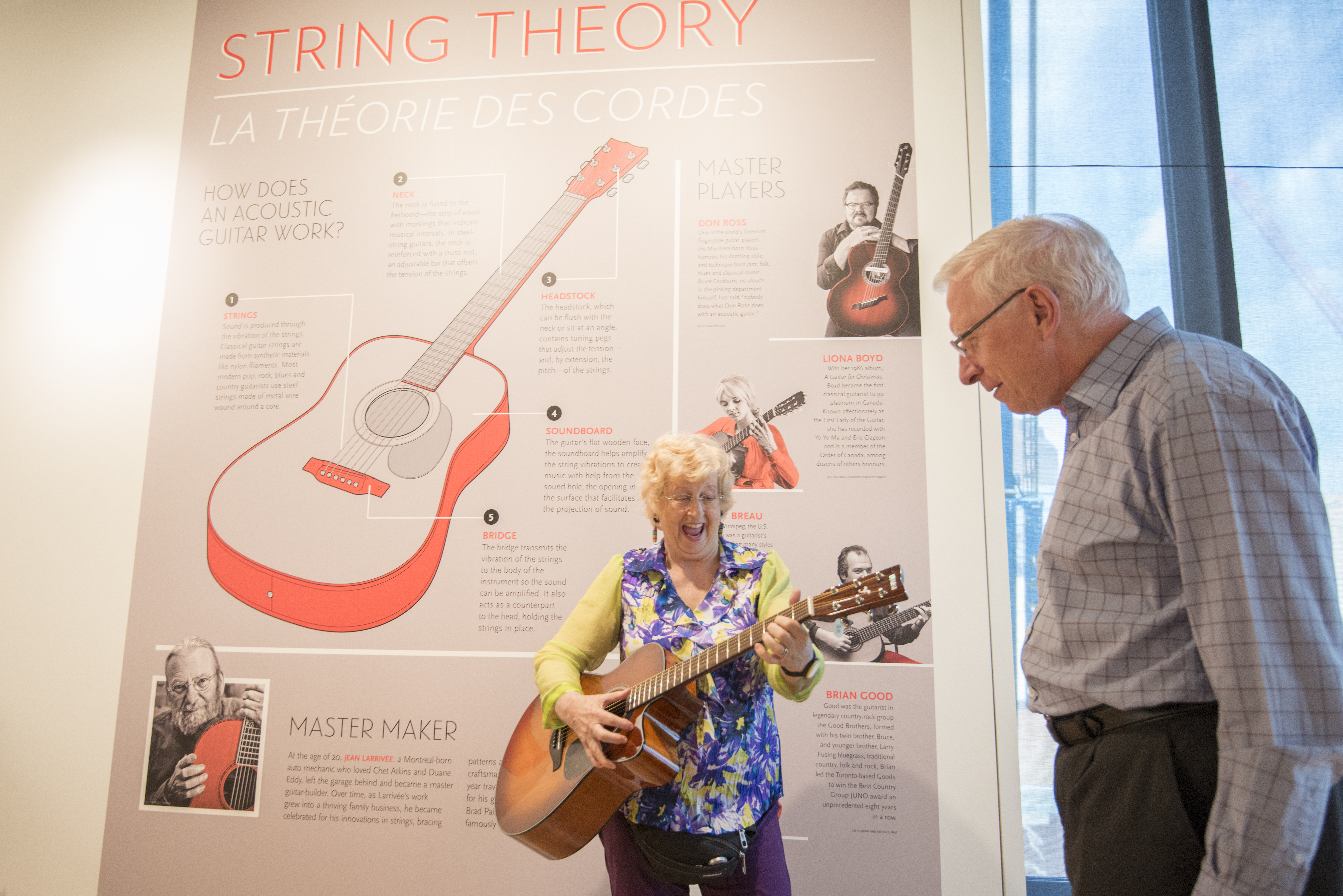 Senior couple visit music instrument interactive exhibit at Studio Bell National Music Centre