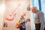 Senior couple visit music instrument interactive exhibit at Studio Bell National Music Centre