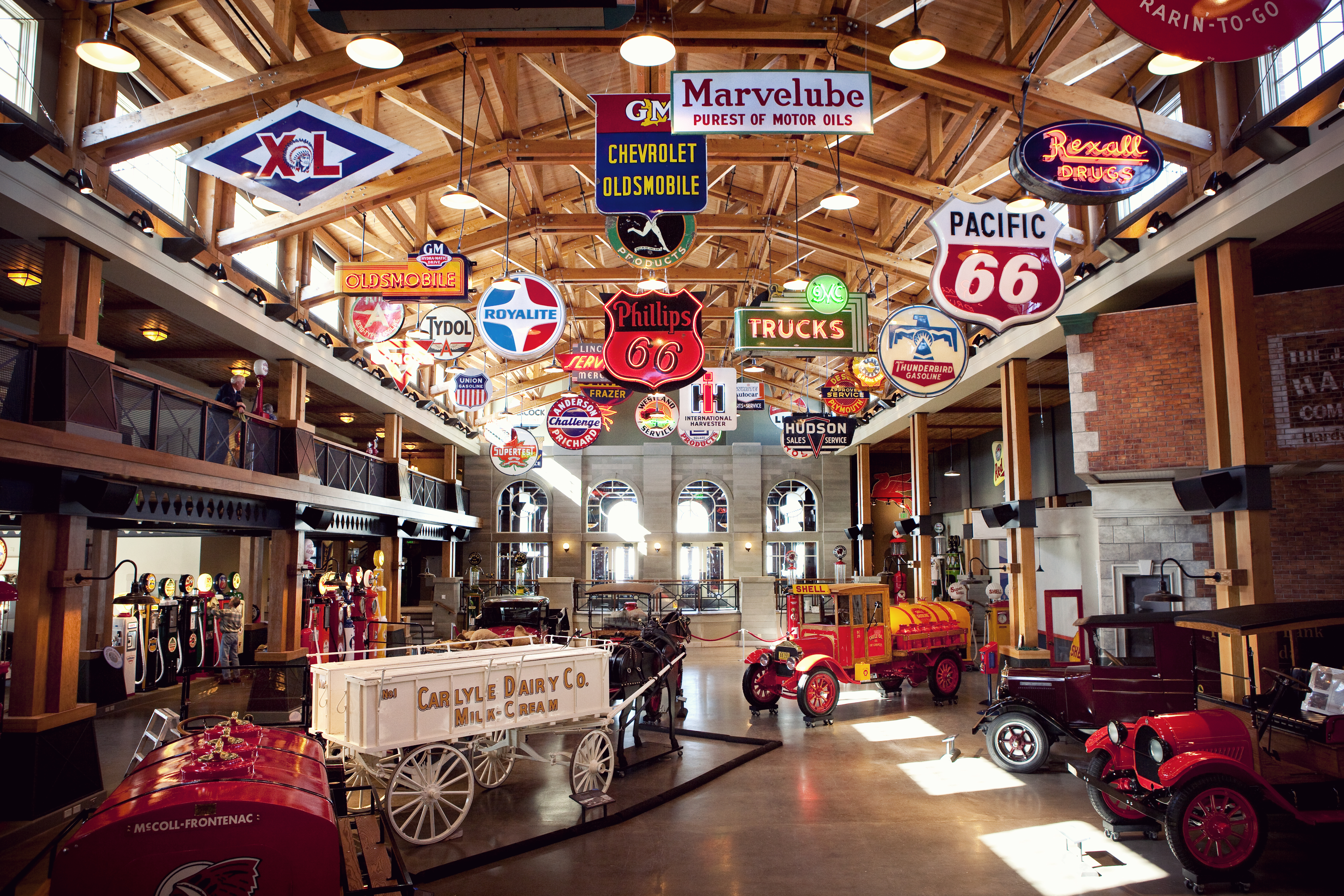 Indoor display of antique vehicles in the Gasoline Alley area of the Heritage Park