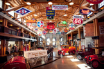 Indoor display of antique vehicles in the Gasoline Alley area of the Heritage Park