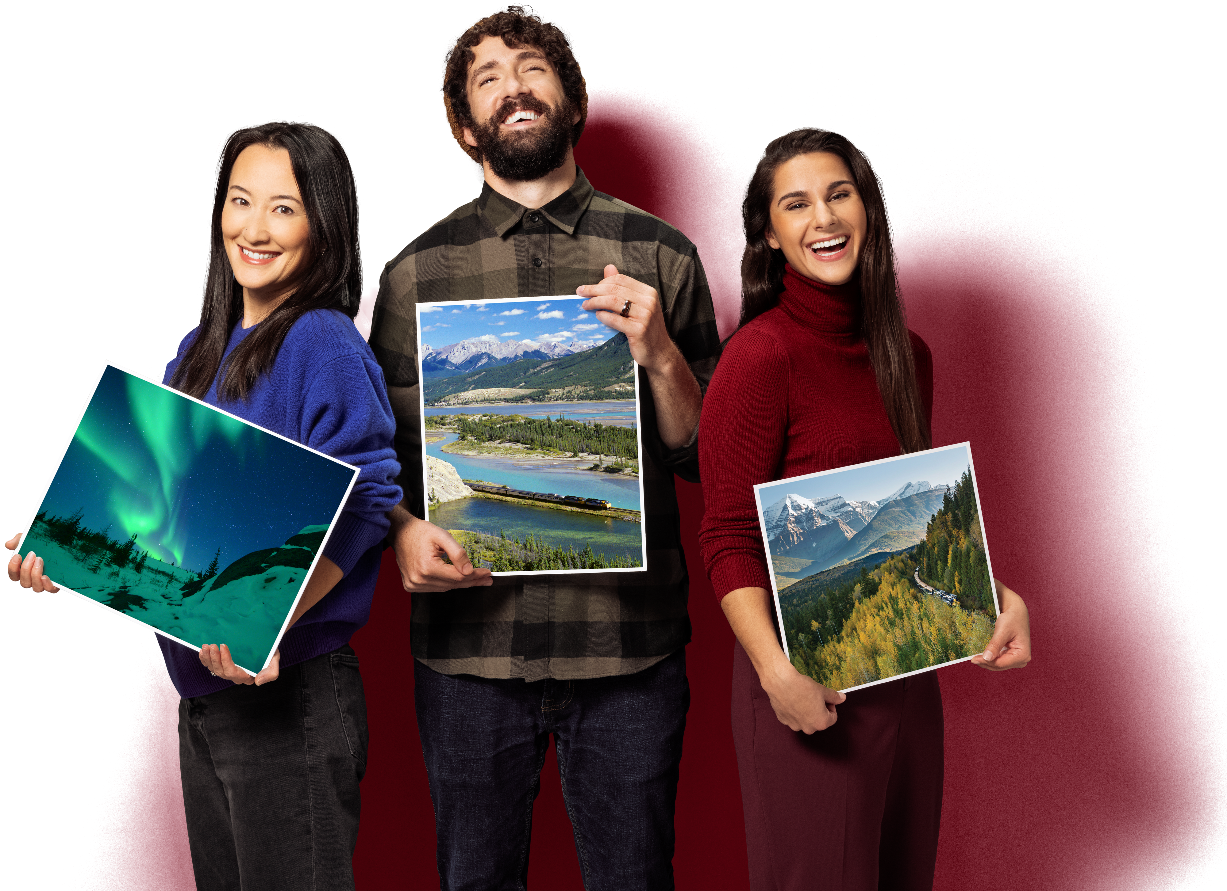 3 people holding signs with Canadian imagery on them