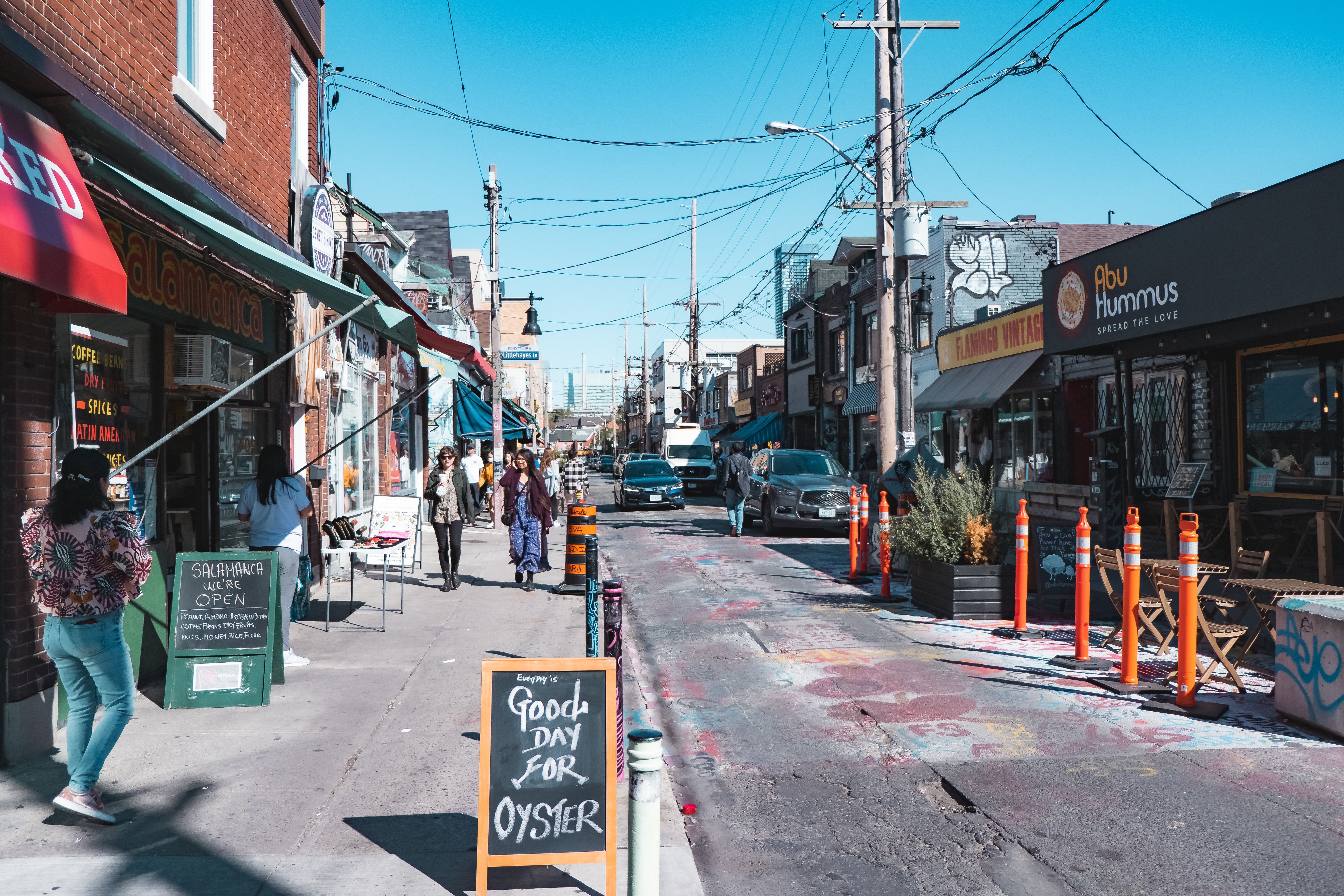 View of street and shops in Kensington Market neighbourhood during daytime
