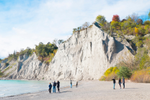 People visiting the Scarbrough bluffs near Toronto with colourful trees