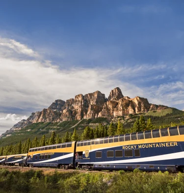 Rocky Mountaineer travelling past Castle Mountain in Banff on the First Passage to the West Route.