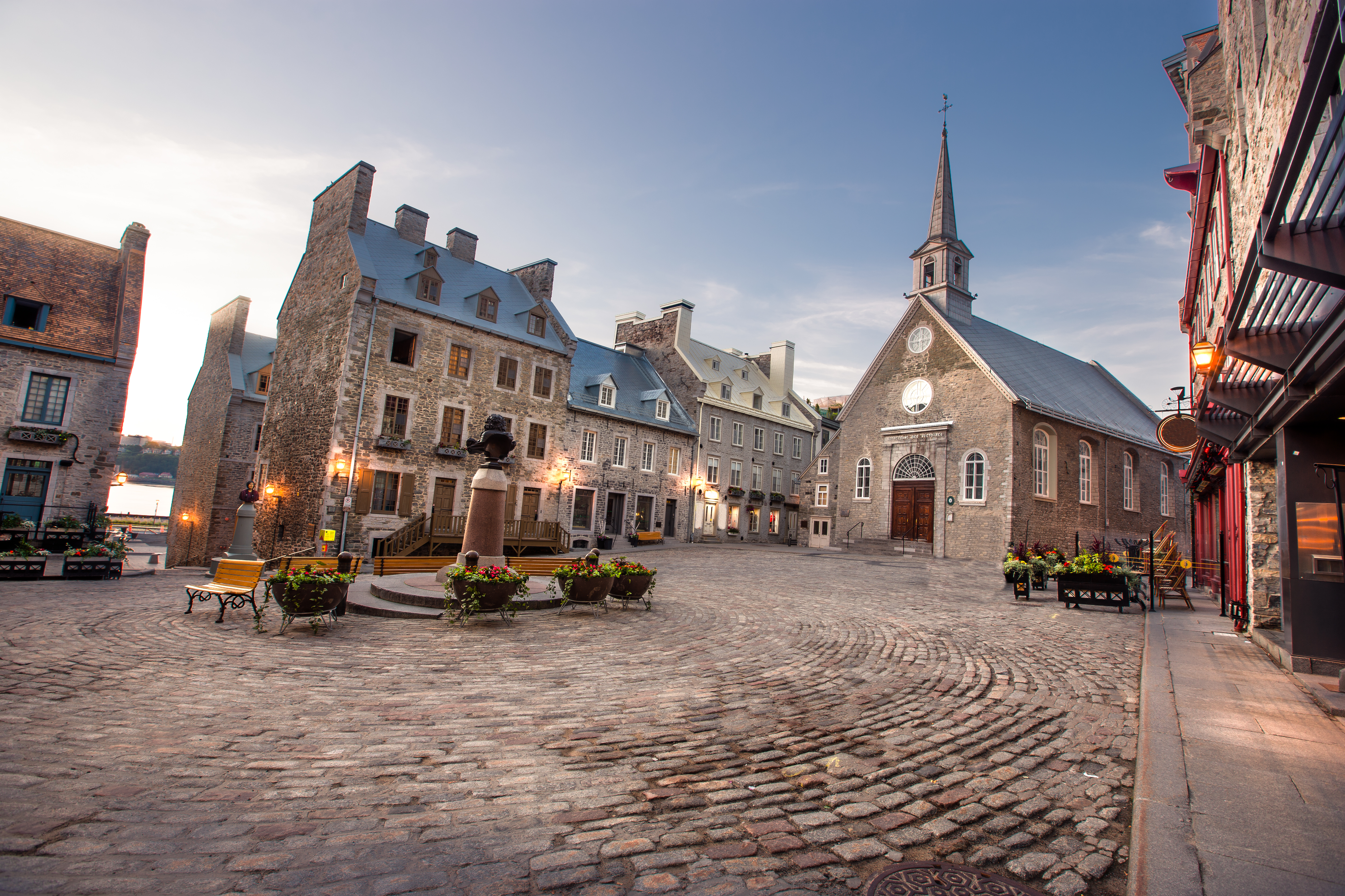 Church and old buildings in a cobblestone square in Old Quebec 