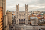 The Notre-Dame Basilica, an iconic landmark in Montreal, is surrounded by historic buildings 