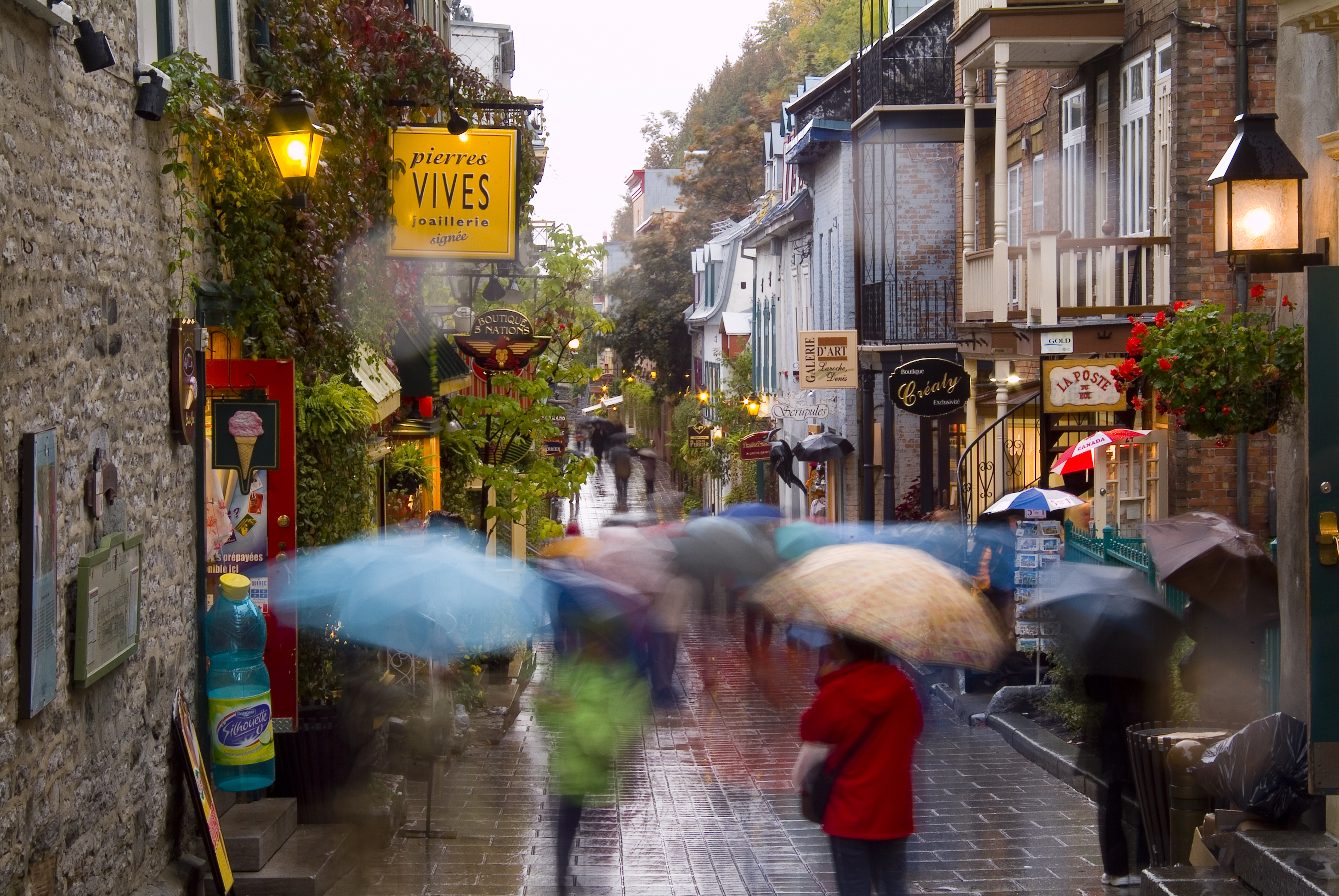 Pedestrians Walking in the Rain on Rue de Petit Champlain