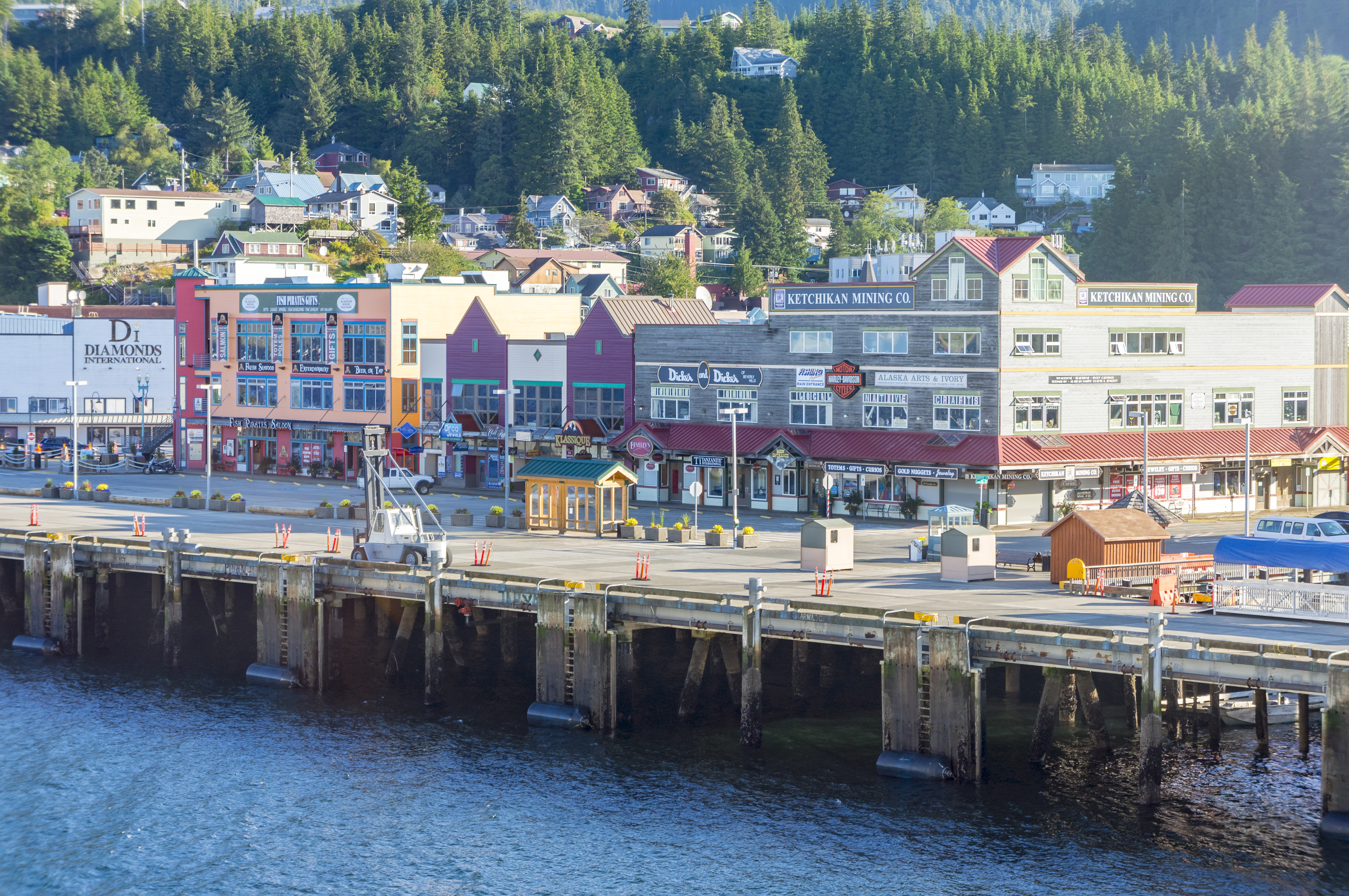 Close up of a road in downtown Juneau by the water with colourful buildings