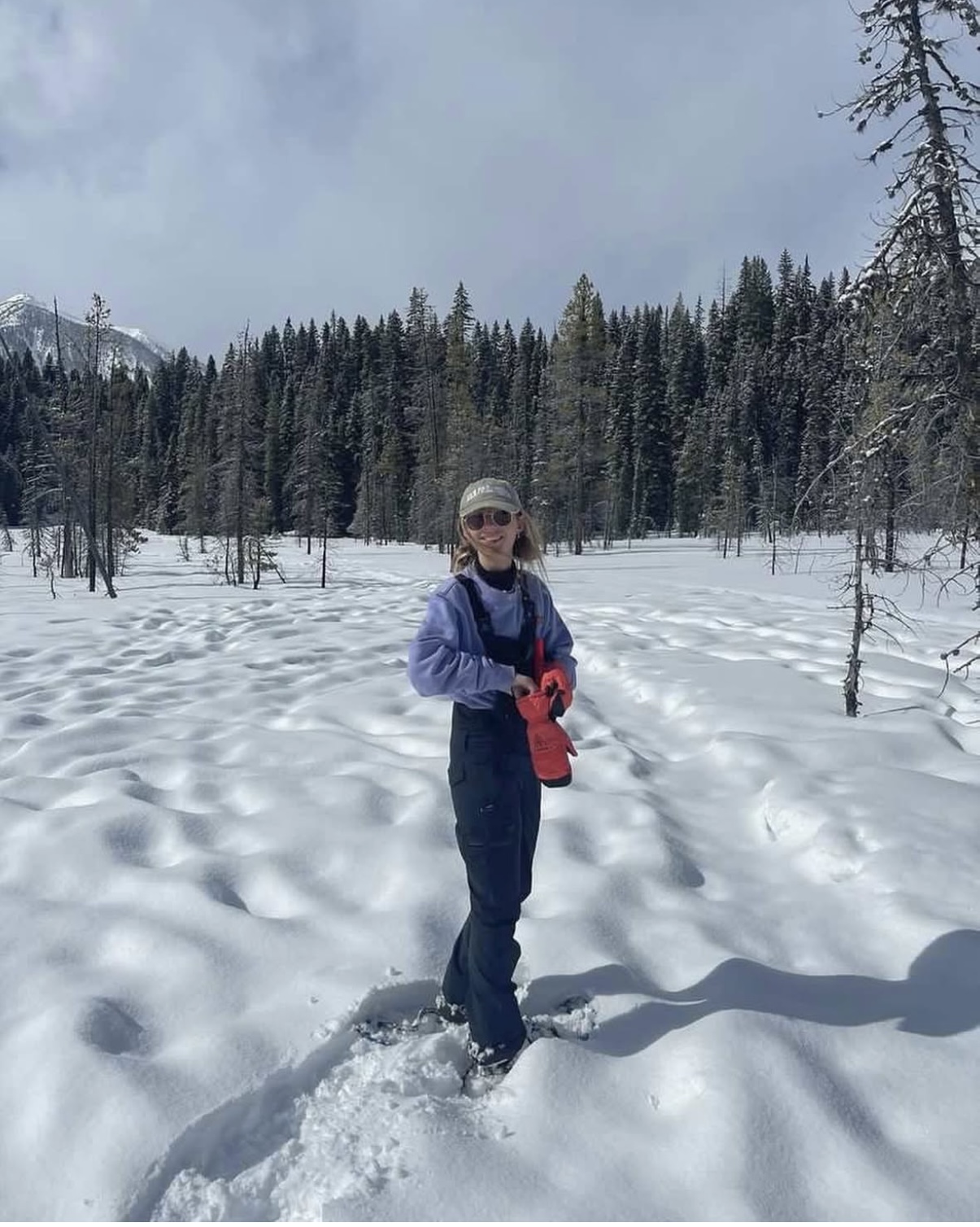 Beth from Discover Banff Tours snowshoeing during the winter season