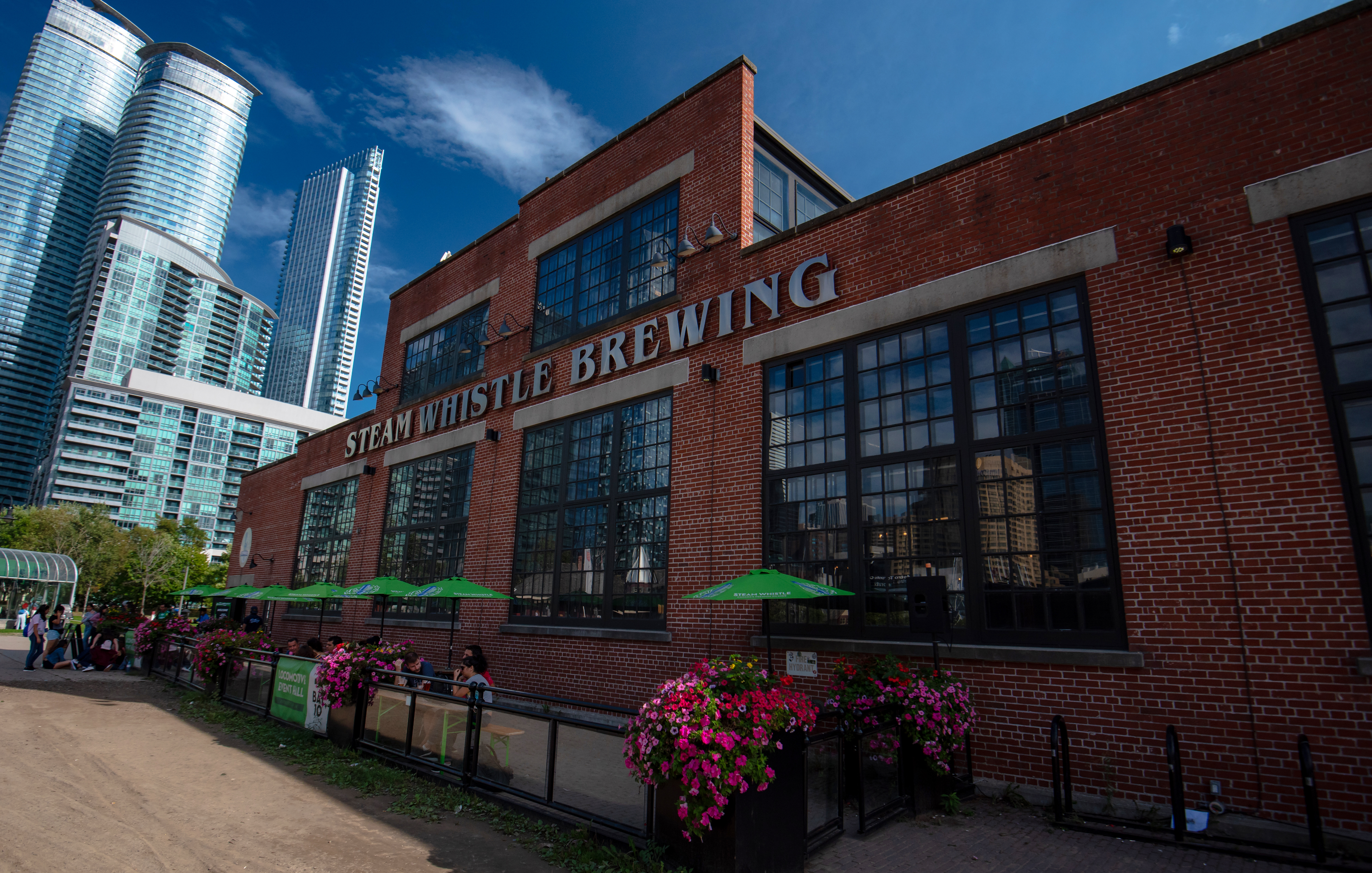 Steam Whistle Brewing signage on red brick building 