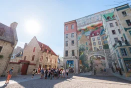 Tourists in front of the Fresque (mural) des Québécois, large city mural in Old Quebec