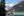 Couple sitting on the edge of Lake Louise in Banff National Park