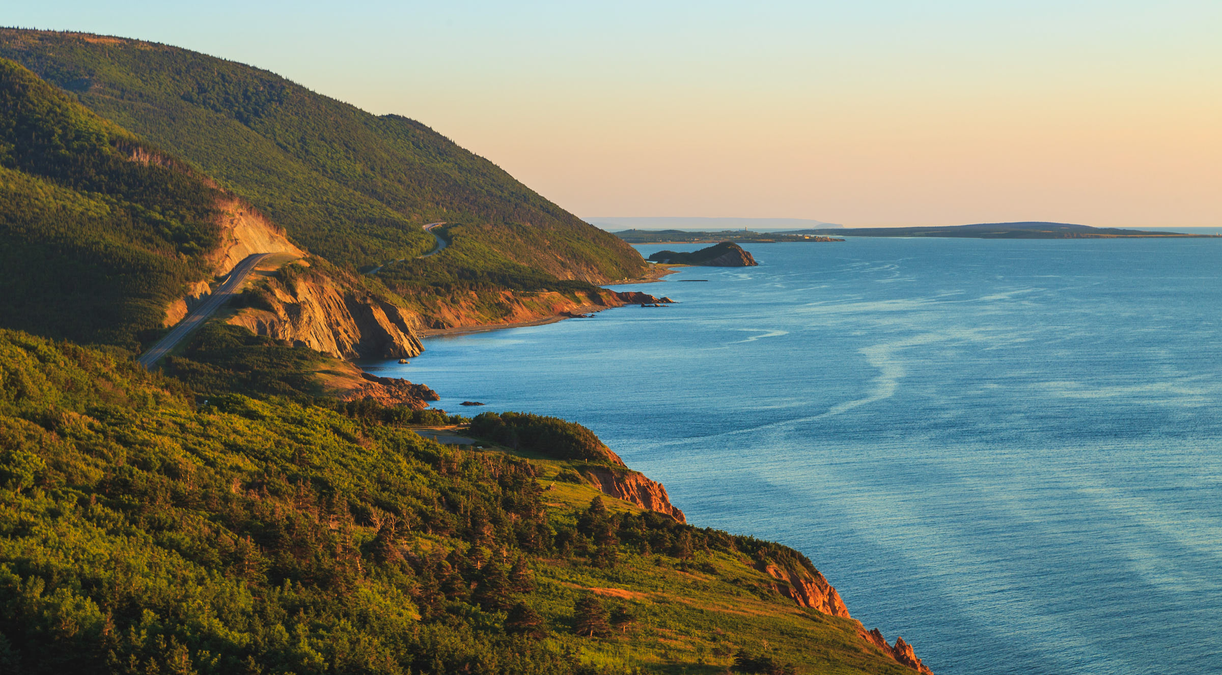 winding road along the coastline and view of the ocean from the Cabot Trail