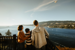 A family looking at the view at Prospect Point in Stanley Park