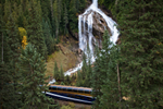 The Rocky Mountaineer train passing Pyramid Falls on the Journey Through the Clouds route.
