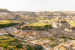 Person and their dog hiking in the badlands of Drumheller