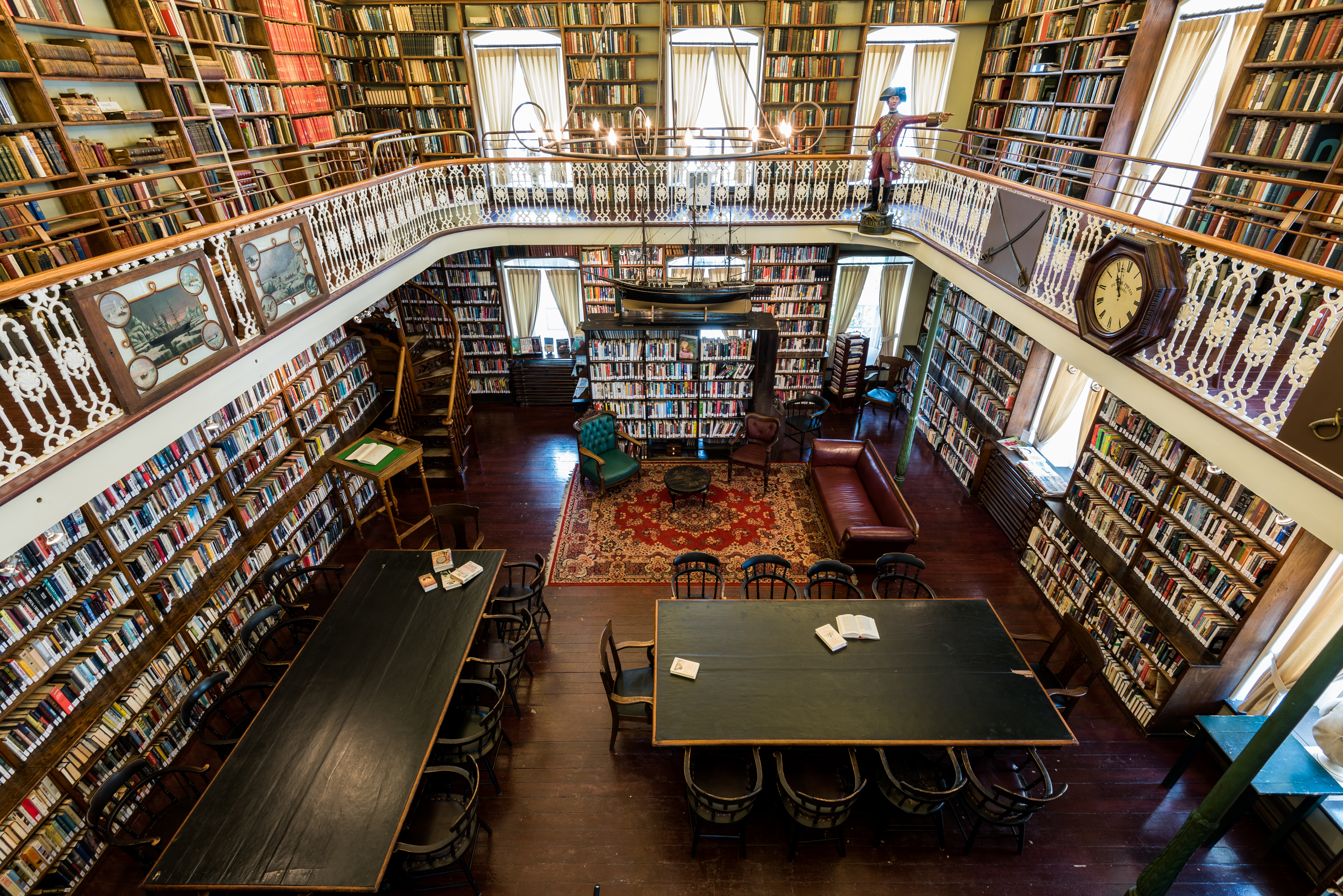 View of book shelves across two levels inside the Morrin Centre Library