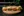 Momofuku steam buns arranged and placed on a wooden board