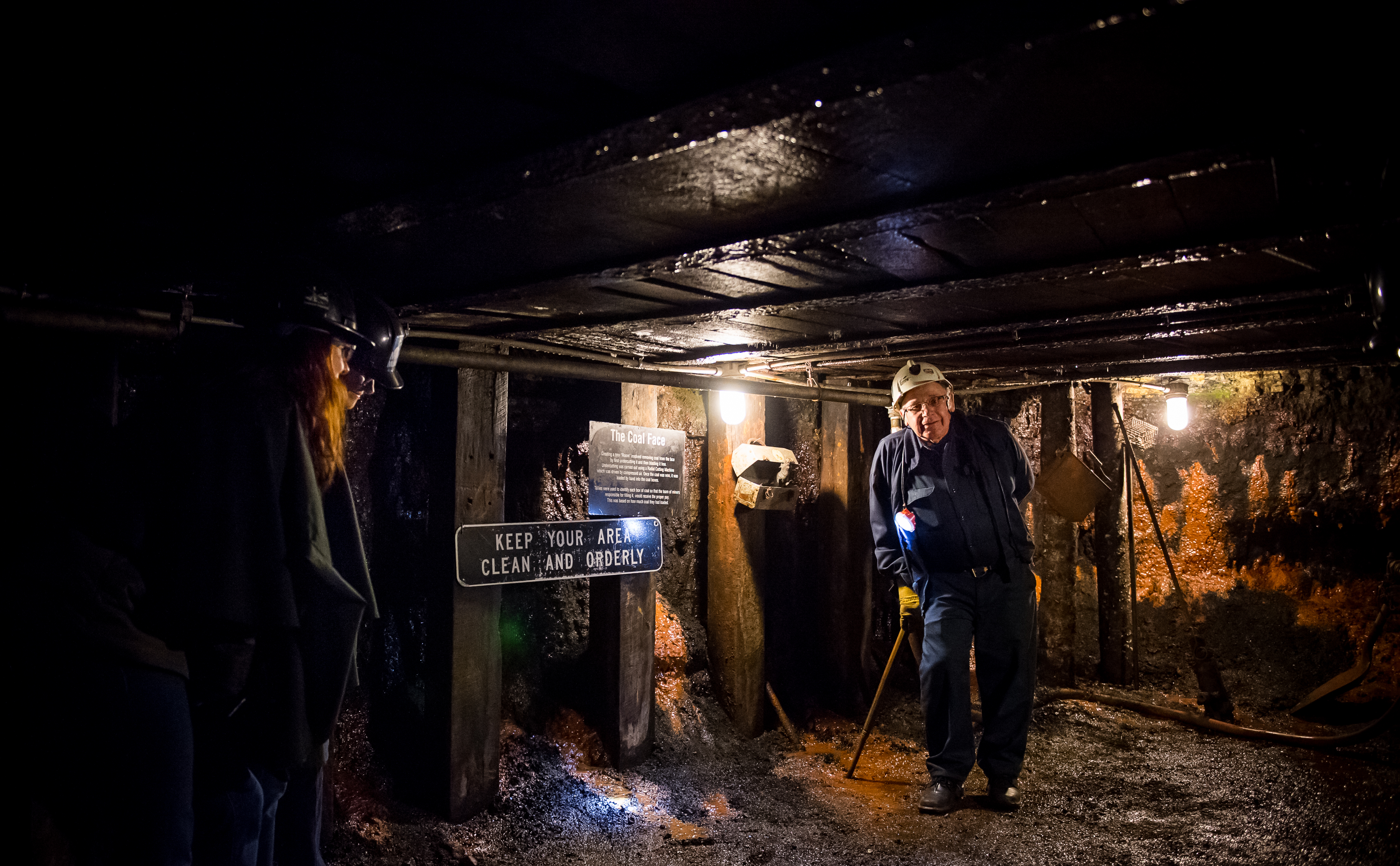 A tour guide talking on an underground mine tour at the Cape Breton Miners' Museum