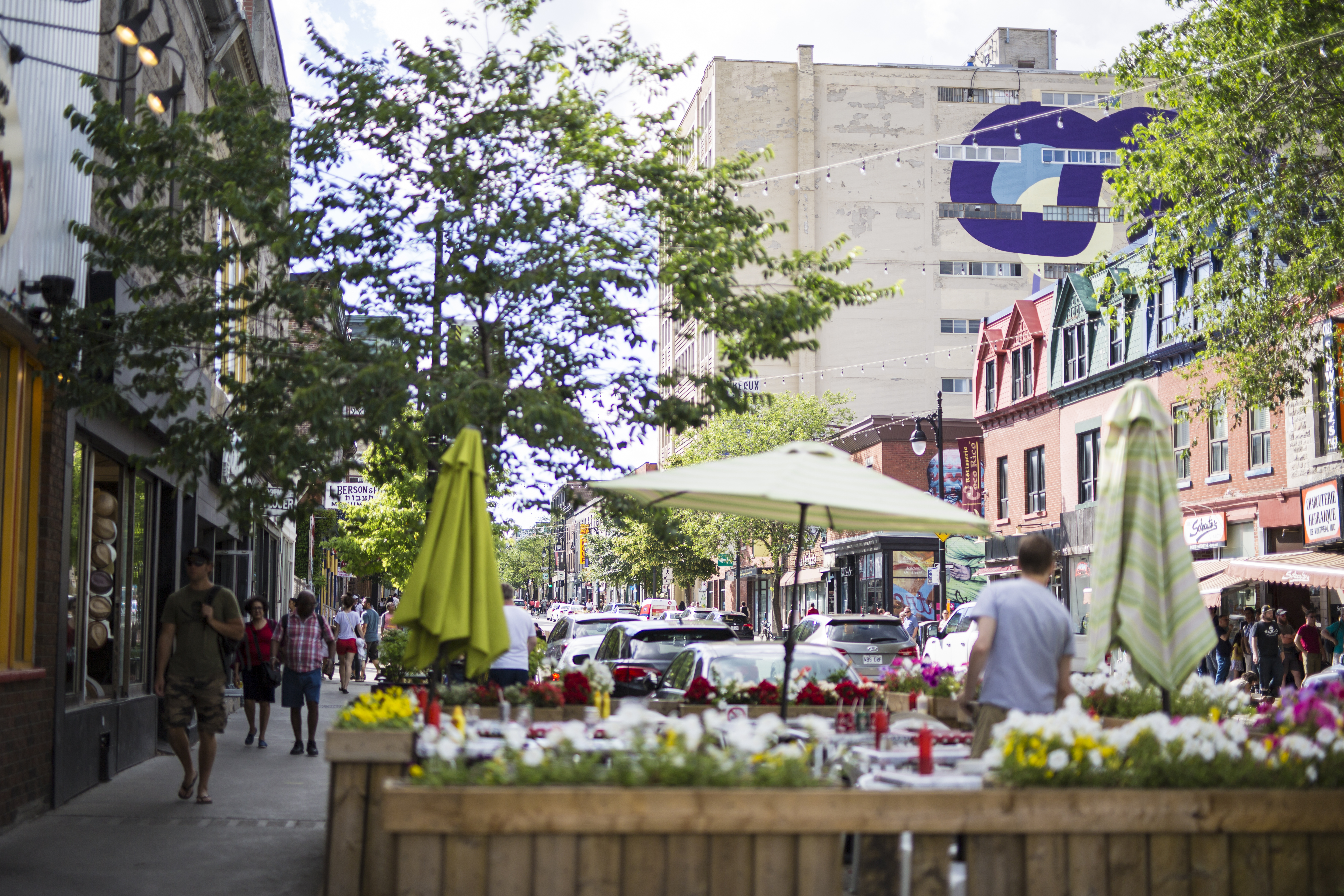 View of restaurant patios down Saint-Laurent Boulevard in Montreal