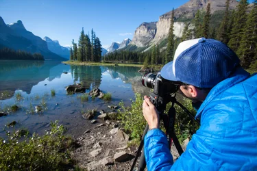 Man taking Picture of Spirit Island in Jasper National Park