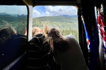 Two people looking out the window of the outdoor area in SilverLeaf on Rocky Mountaineer