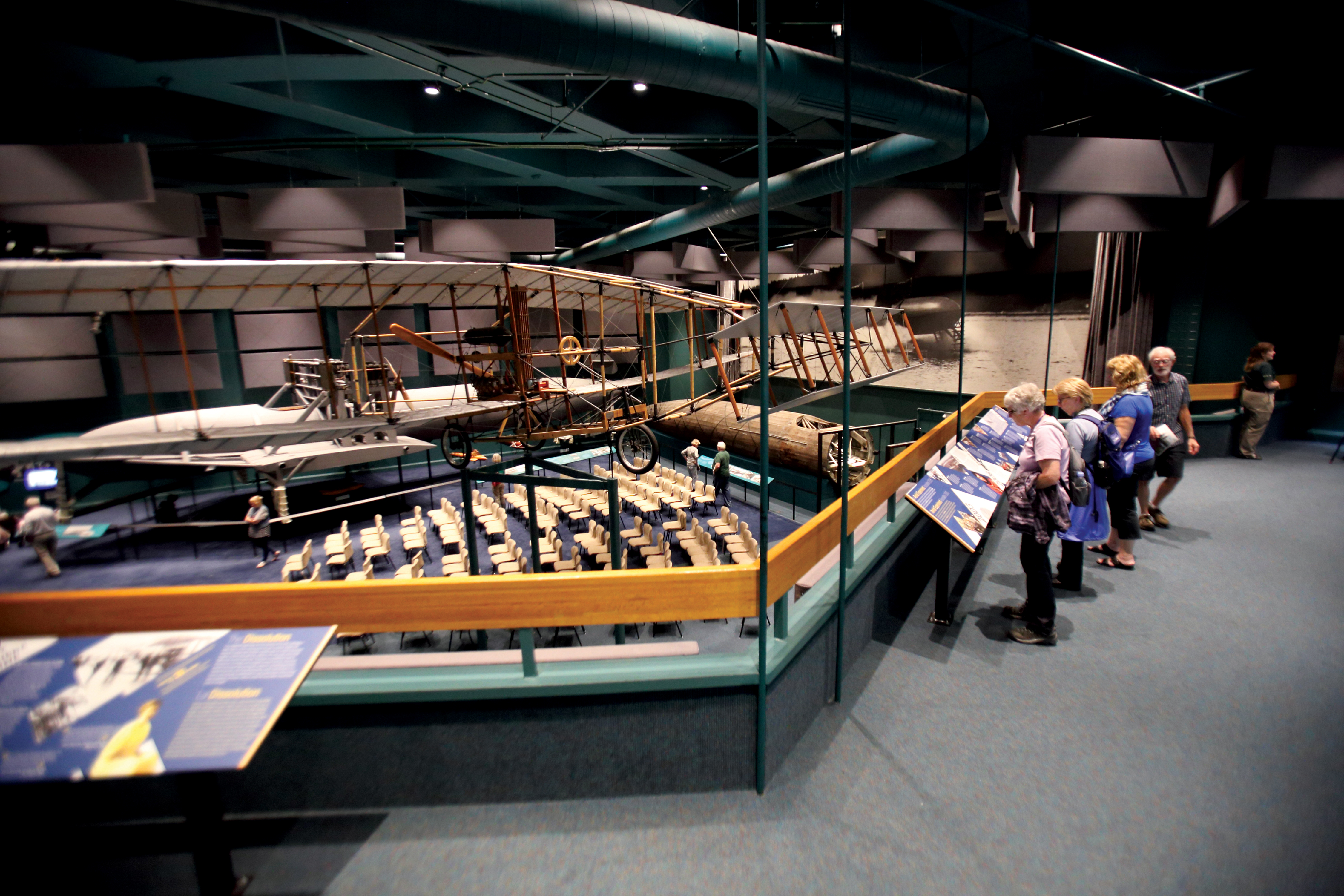 People looking at replicas of airplanes at the Alexander Graham Bell National Historic Site
