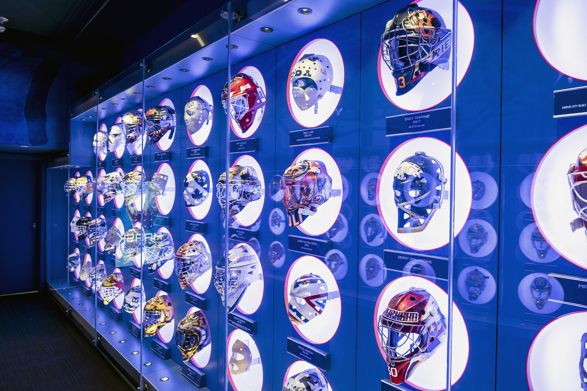 A display of colourful hockey masks in the Hockey Hall of Fame museum