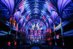 Beautiful purple, blue and red light projections inside the Notre-Dame Basilica 