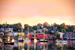 The sun sets over fishing boats and colourful homes in Lunenburg