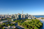 View of downtown Toronto with the CN tower in the middle, surrounded by parks and the waterfront