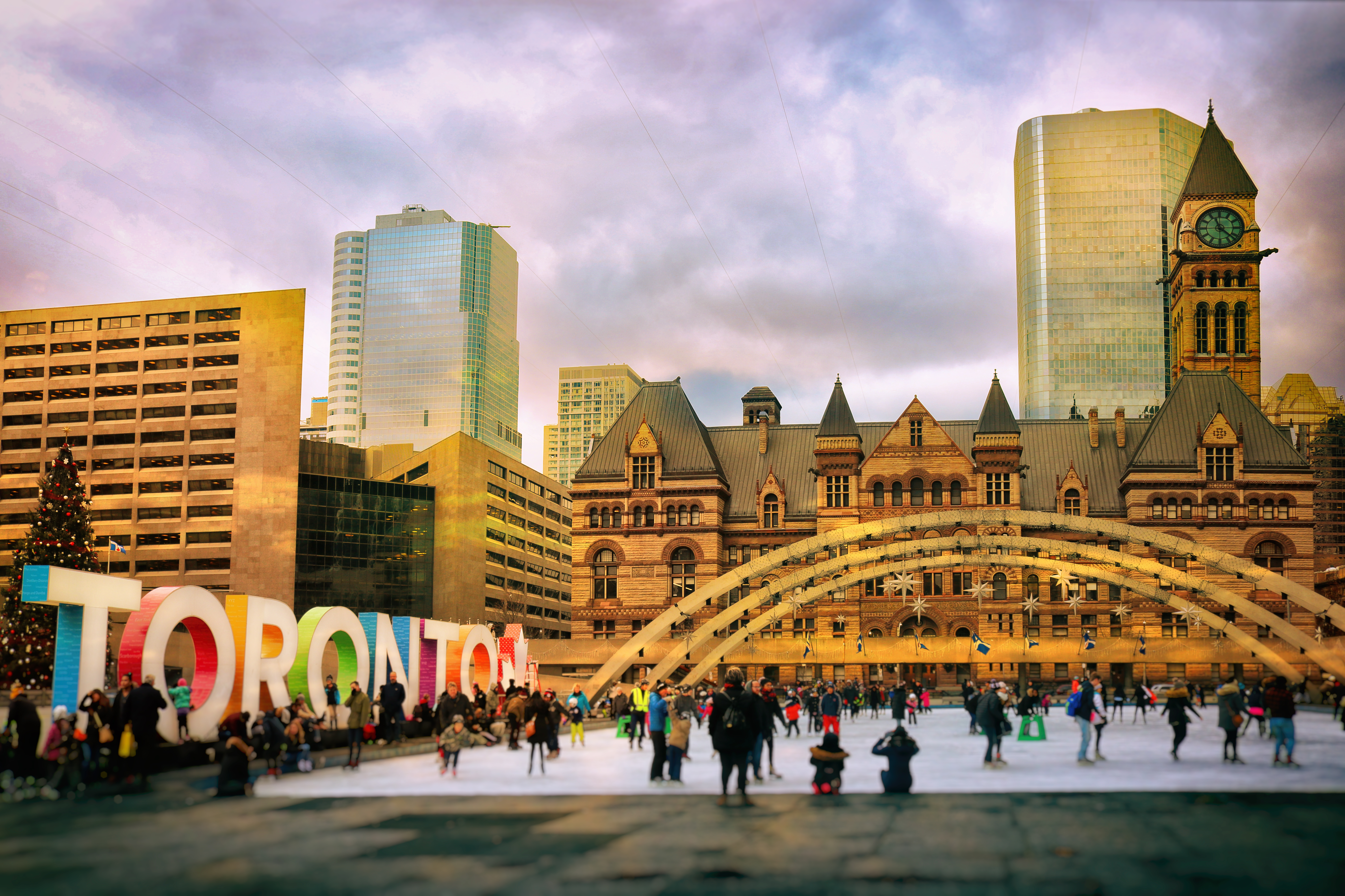 People having fun by the colourful Toronto sign at Nathan Phillips Square