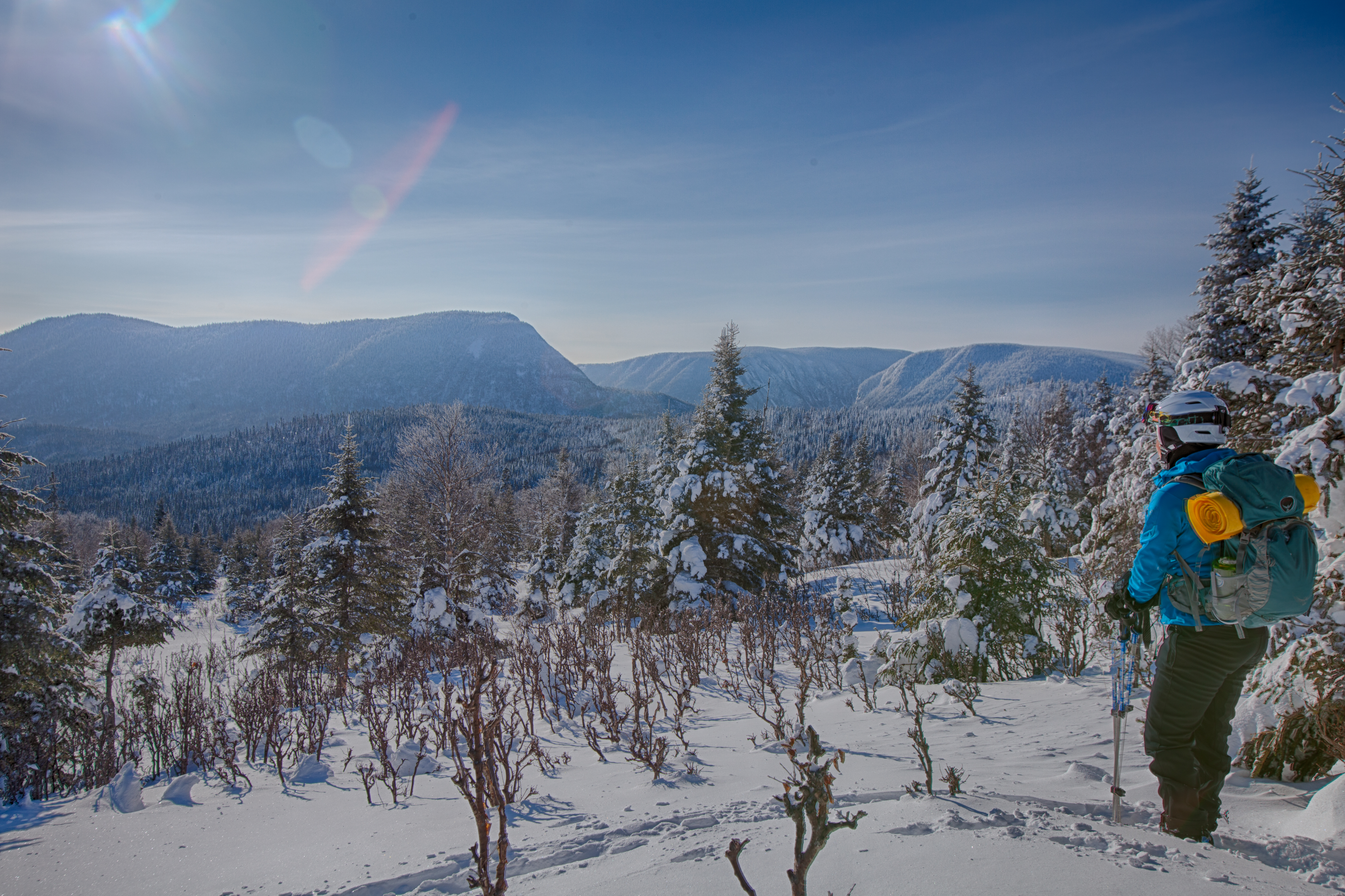A person off piste skiing in the mountains in Quebec