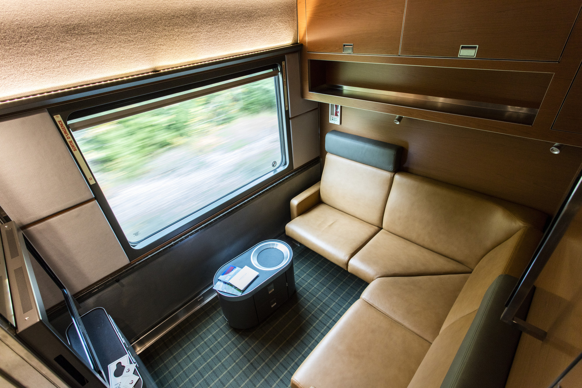 The Prestige cabin on The Canadian train includes an L-shaped couch facing a large picture window