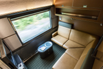The Prestige cabin on The Canadian train includes an L-shaped couch facing a large picture window