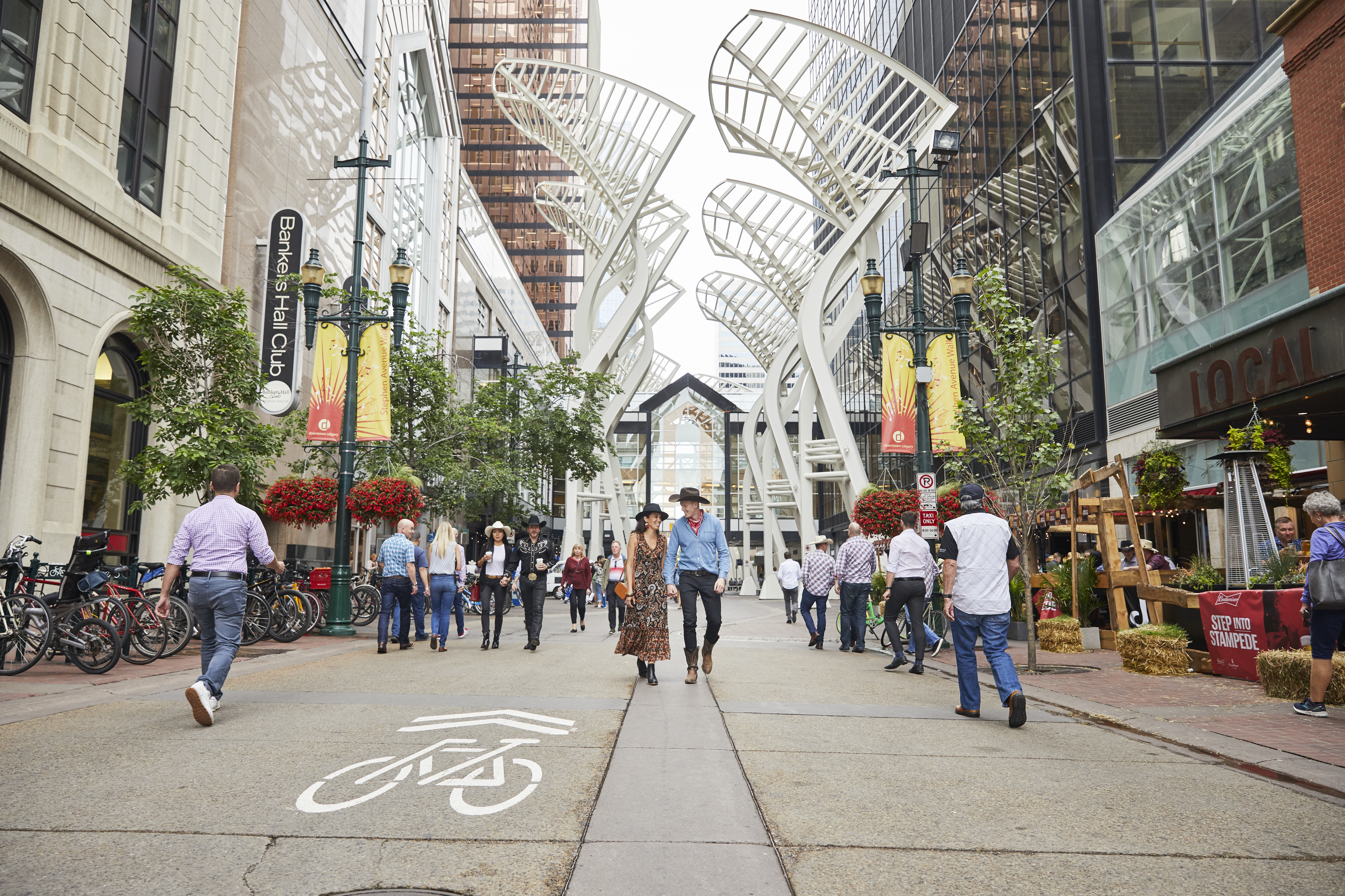 Couple walking down Stephen Avenue 