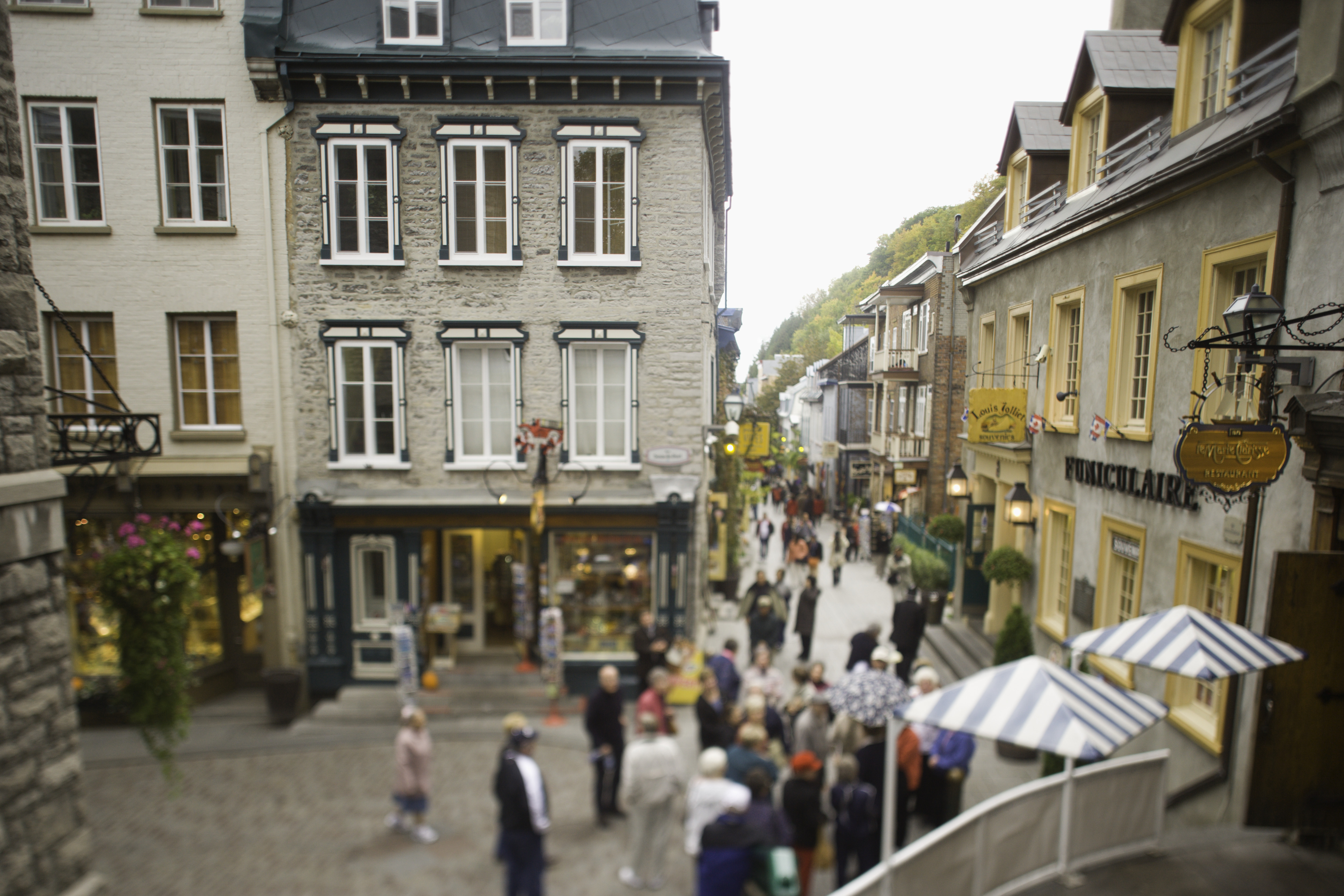 Group of people exploring the historic Petit-Champlain neighbourhood in Quebec City