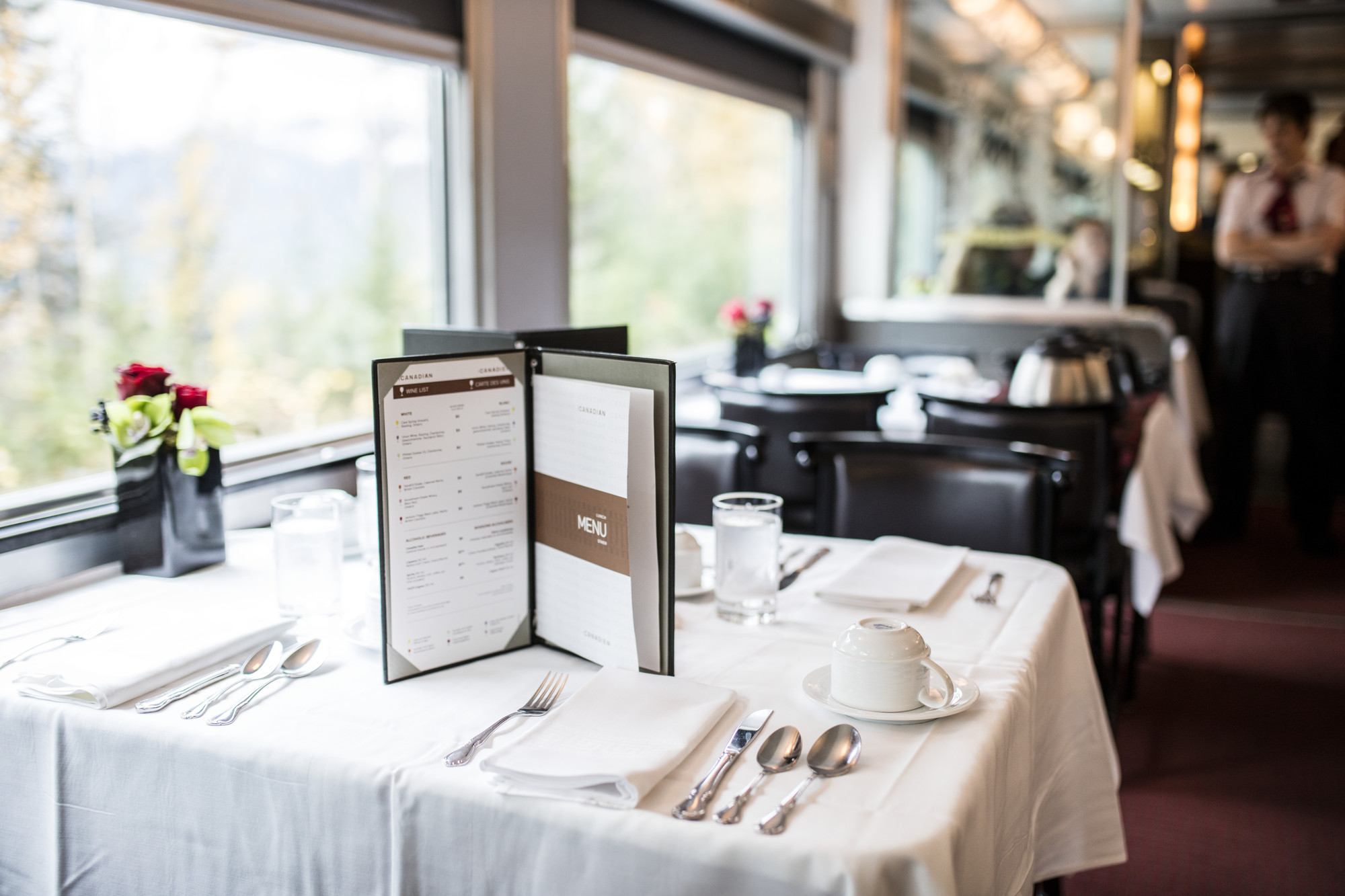 Menu on a table next to the windows in the dining car of VIA Rail’s Canadian train 